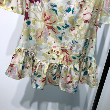 Rochie scurtă cu mâneci lotus și spate gol