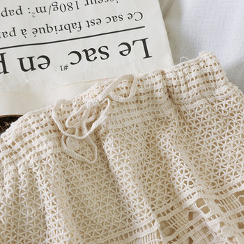 Fusta dama tricotata cu legaturi in talie in alb si bej