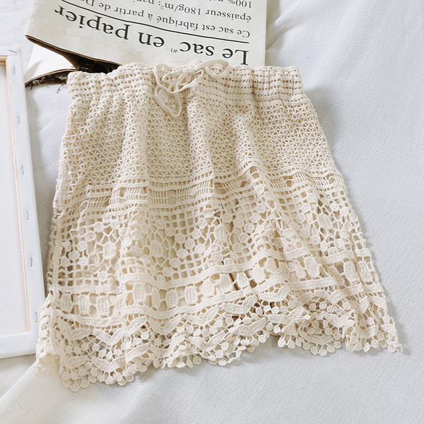 Fusta dama tricotata cu legaturi in talie in alb si bej