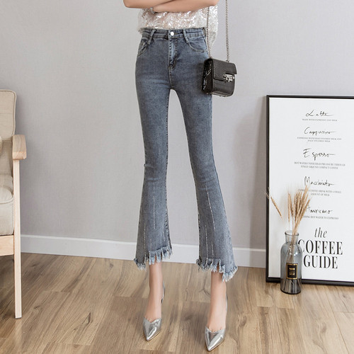 Blugi de dama actuali in gri cu motive rupte cu talie inalta