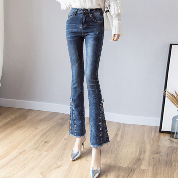 Blugi moderni de dama cu talie standard intr-o culoare inchisa