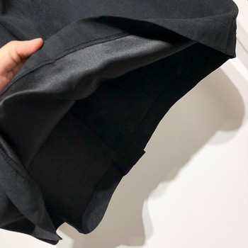 Hosszú alkalmi szoknya fekete gombokkal