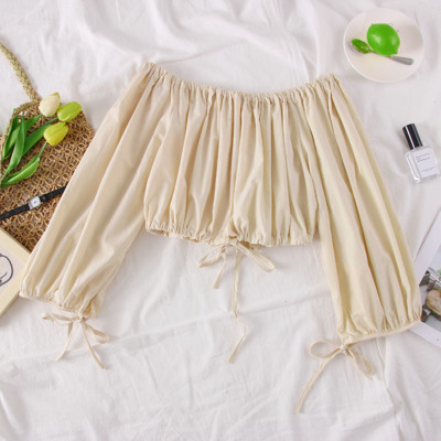 Bluză de damă elegantă cu umerii goi, în verde, negru și bej