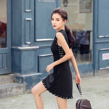 Rochie moderna de dama cu buzunar in negru si element metalic