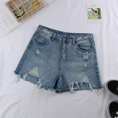 Blugi scurti de dama de culoare albastra cu motive rupte si buzunare