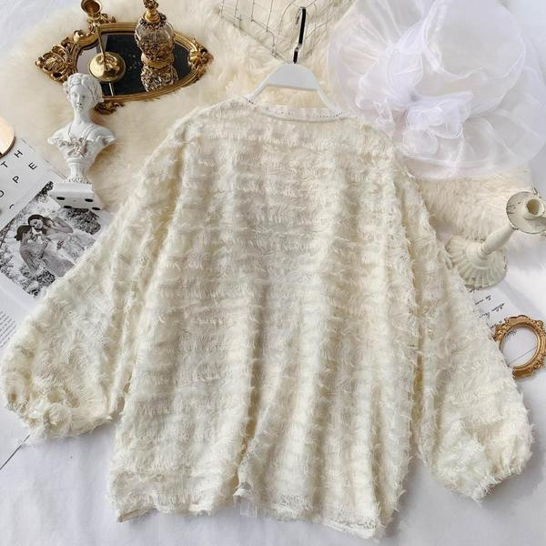 Vestă modernă de damă în alb, bej și negru