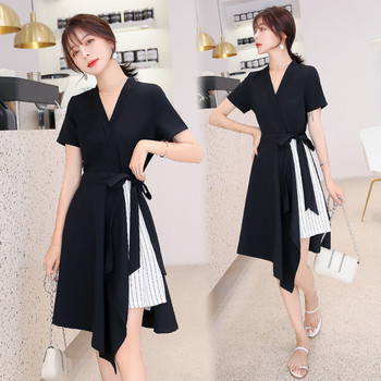 Rochie modernă de damă în alb și negru, cu decolteu în V