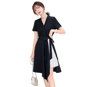 Rochie modernă de damă în alb și negru, cu decolteu în V