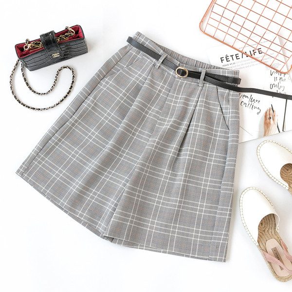 Pantaloni de damă în carouri cu talie înaltă - un model larg