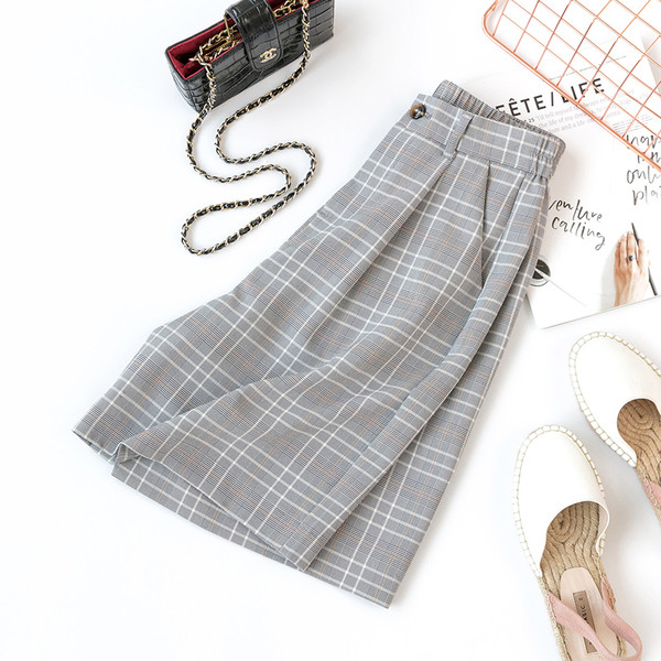 Pantaloni de damă în carouri cu talie înaltă - un model larg