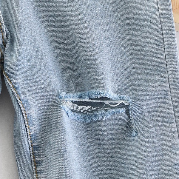 Blugi de dama model nou 3/4 cu motive rupte in albastru