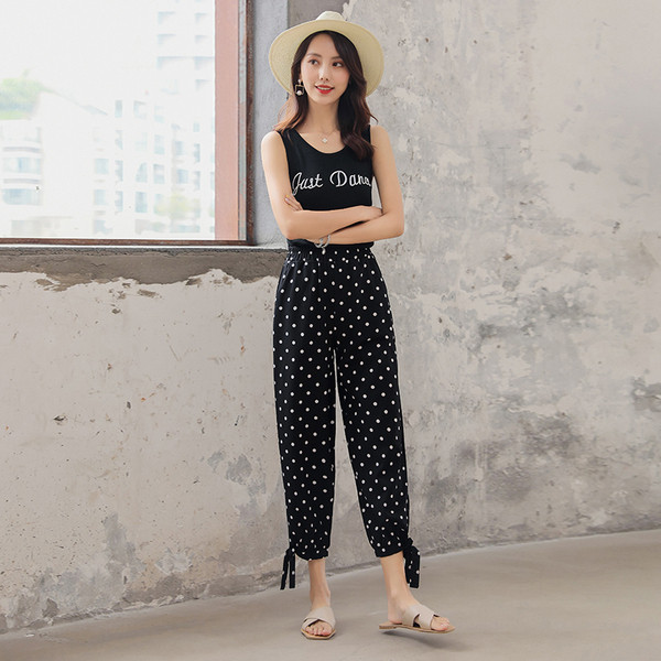 Pantaloni casual de damă cu buline în negru