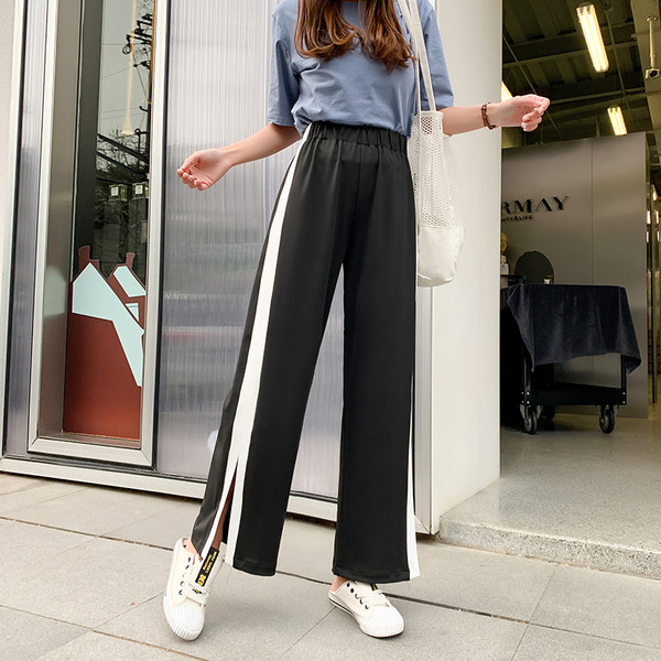 Pantaloni moderni de dama cu margini si crapatura de culoare neagra