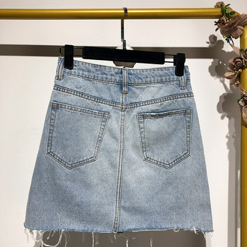 Rövid farmerszoknya kék gombokkal