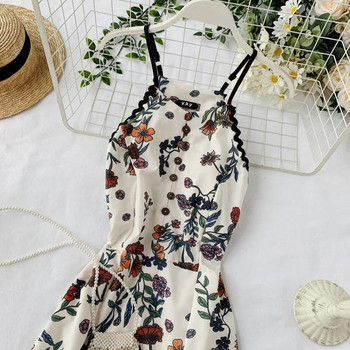 Hosszú női ruha vékony pántokkal, fehér színben, virágmintával