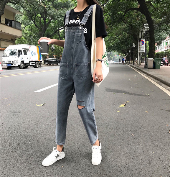 Női farmer overall szakadt motívumokkal, kék színben