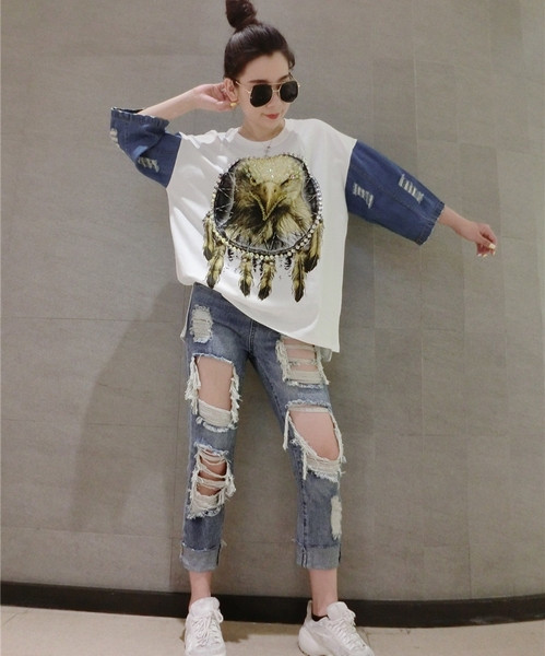 Aktuális női farmer szakadt motívumokkal, kék színben