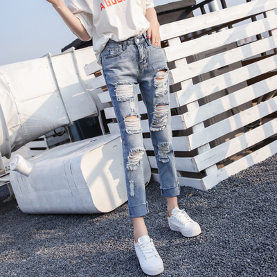 Női alkalmi farmernadrág standard derékkal, szakadt motívumokkal