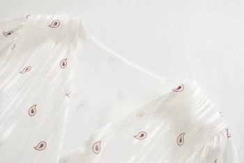 Modern női ruha övvel és V-nyakú fehér színben