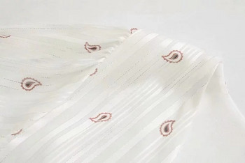 Modern női ruha övvel és V-nyakú fehér színben