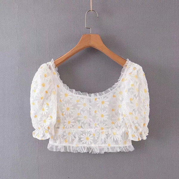 Új modell női blúz virágos motívumokkal, fehér színben