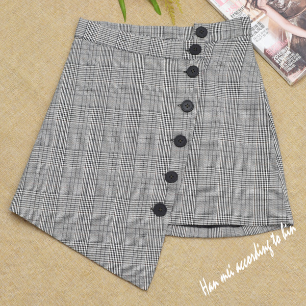 Női szoknya aszimmetrikus modell több színben gombokkal