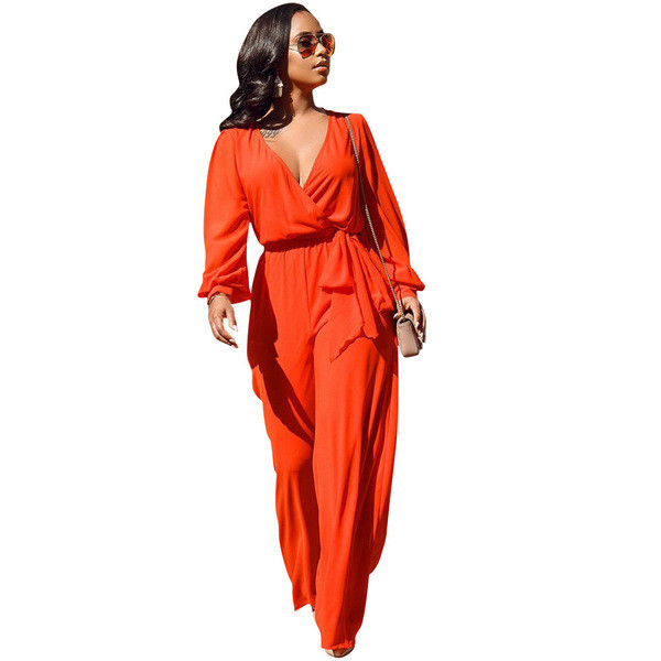 Salopetă de damă elegantă, cu decolteu adânc și mâneci lungi, de culoare portocalie