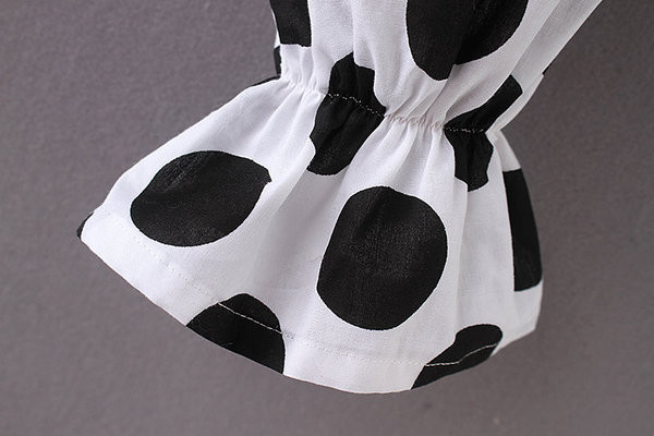 Bluză de damă elegantă cu buline în alb