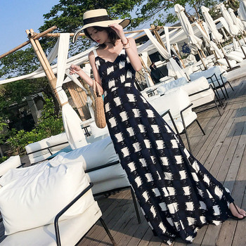 Hosszú női ruha, hátulján szalaggal, fekete-fehér színben