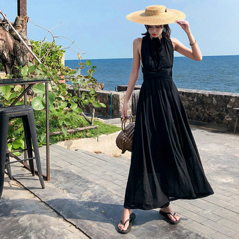 Hosszú női ruha keresztezett pántokkal, fekete színben