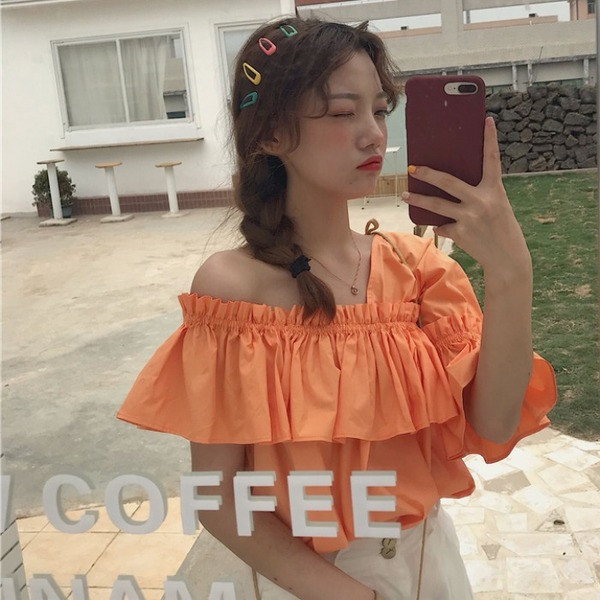 Bluză de damă modernă în alb și portocaliu