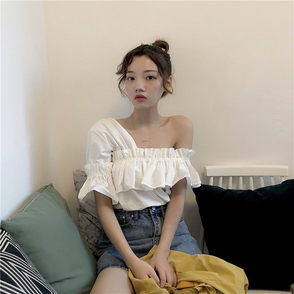 Bluză de damă modernă în alb și portocaliu