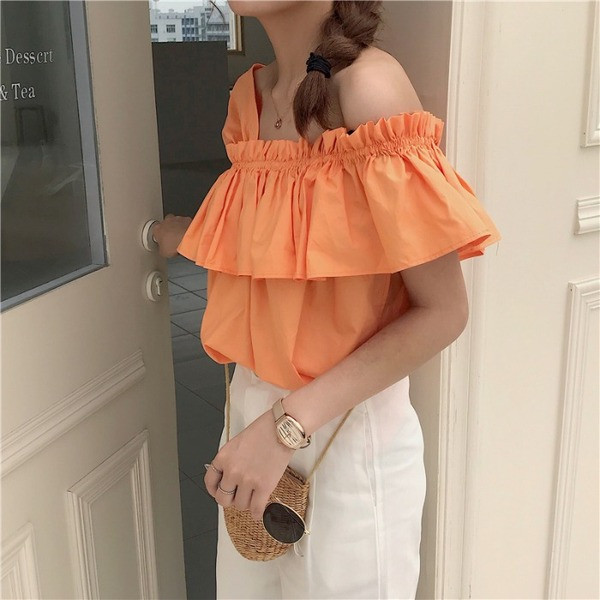 Bluză de damă modernă în alb și portocaliu