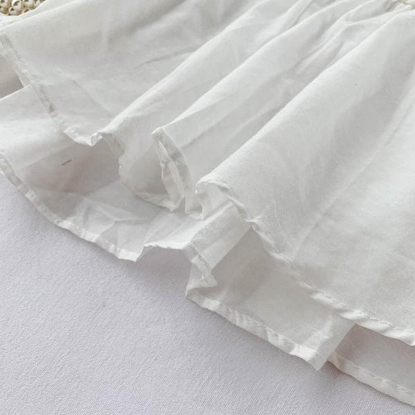 Model elegant de bluză de damă cu mâneci scurte și broderie în alb