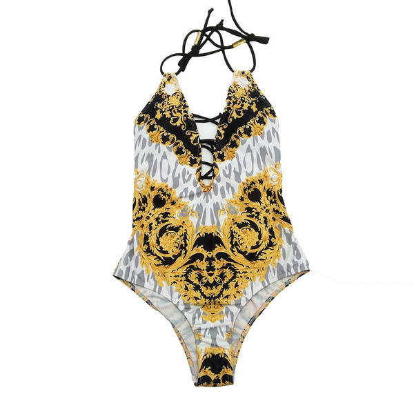 Costum de baie de damă cu decolteu adânc de culoare aurie