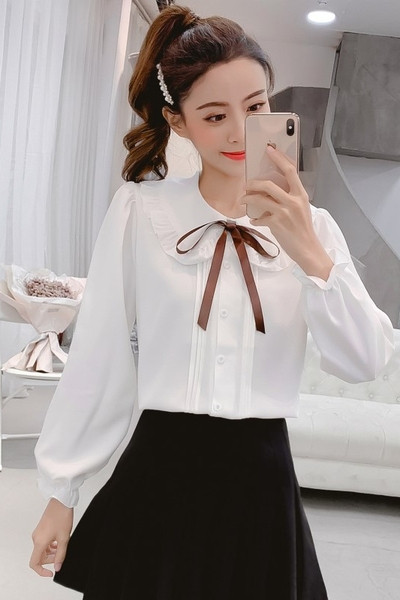 Aktuális női ing fehér és rózsaszín színben, nyakkendővel