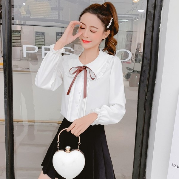 Aktuális női ing fehér és rózsaszín színben, nyakkendővel