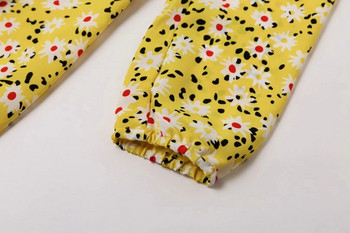 Modern női ruha virágos motívumokkal, sárga színben