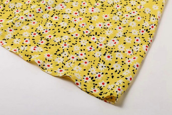 Modern női ruha virágos motívumokkal, sárga színben