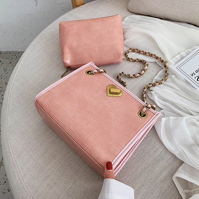 Eko bőrből készült stílusos női táska fém fogantyúval, különböző színekben