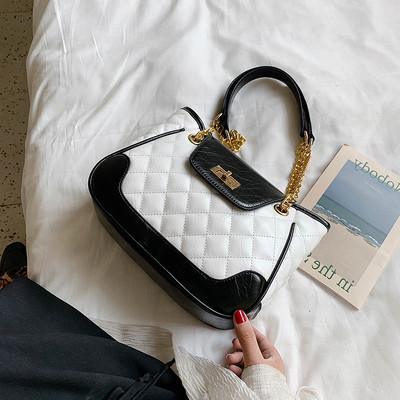 Geanta de dama moderna cu elemente metalice alb-negru