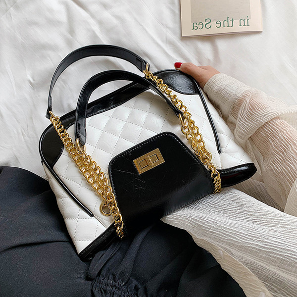 Geanta de dama moderna cu elemente metalice alb-negru