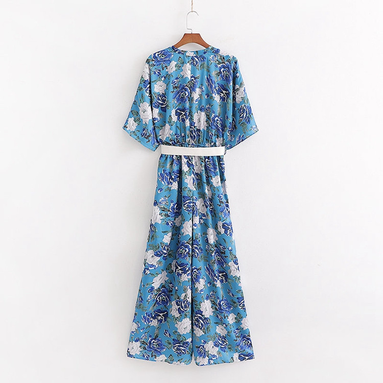 Női overál mély V-nyakkal és övvel