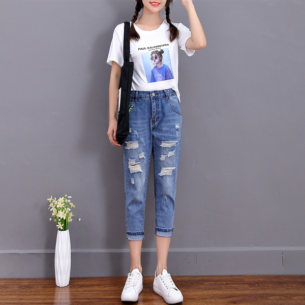 Blugi de dama moderni lungime 9/8 cu motive rupte