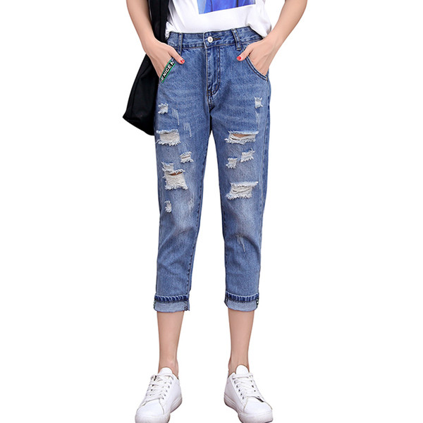 Blugi de dama moderni lungime 9/8 cu motive rupte