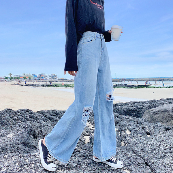 Női farmer széles modell szakadt motívumokkal és méretekkel 4XL-ig