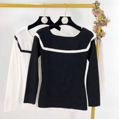 Bluză de damă cu decolteu oval în alb și negru