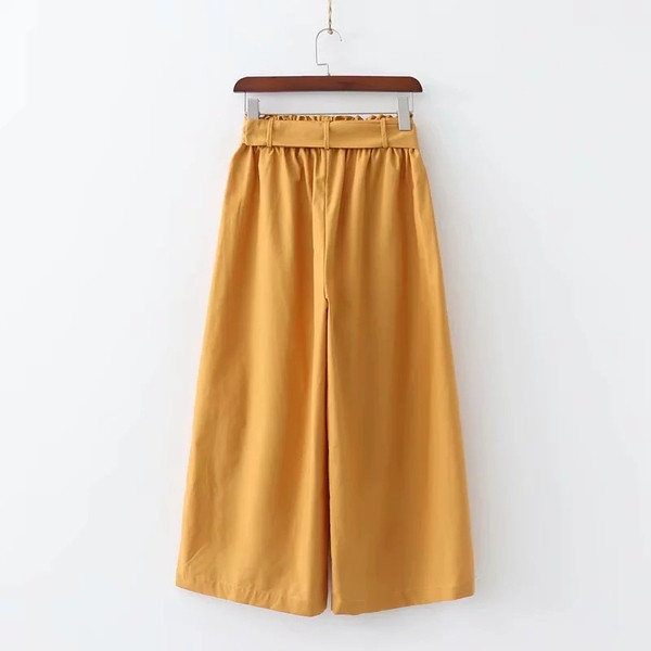 Modern női nadrág - széles modell sárga színben