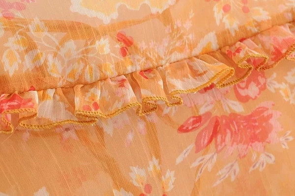 Női blúz narancssárga mintával