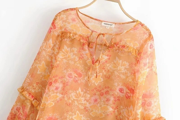 Női blúz narancssárga mintával